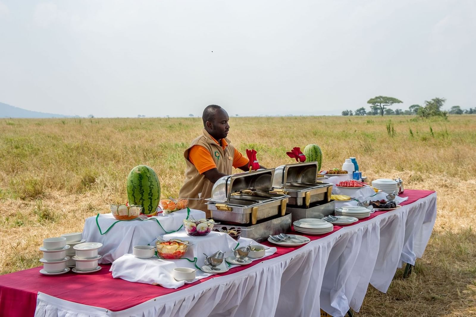 Private in-bush dinner table with lanterns in Tanzania — luxury dining experience on Safari Sutra tour